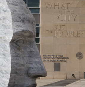 Denver’s Wellington E. Webb Municipal Office Building, inscribed “What is the city but the people?”